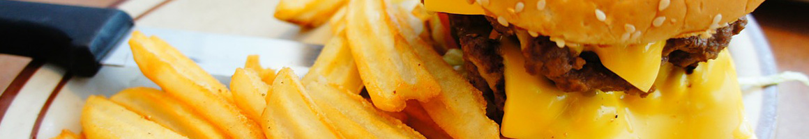 Eating American (Traditional) Burger at Mike's Drive-In restaurant in West Frankfort, IL.